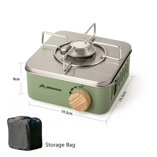 Green portable camping gas stove with a silver metal top, burner, and wooden control knob, plus black storage bag.